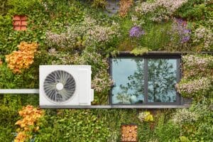Air source heat pumps outside on a flowery building